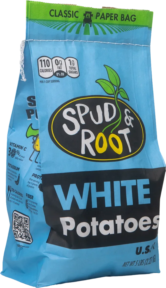 Spud & Root White Potatoes: a sky-blue 5 lb paper bag with the black oval Spud & Root logo, a green sprout, and 'WHITE Potatoes' in a black band.
