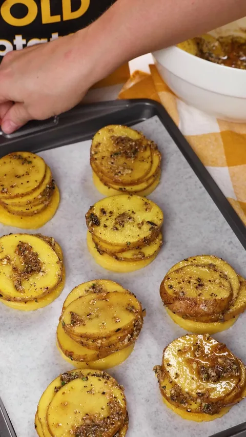 The baked medallions on the sheet, the potato slices golden and crisp at the edges.
